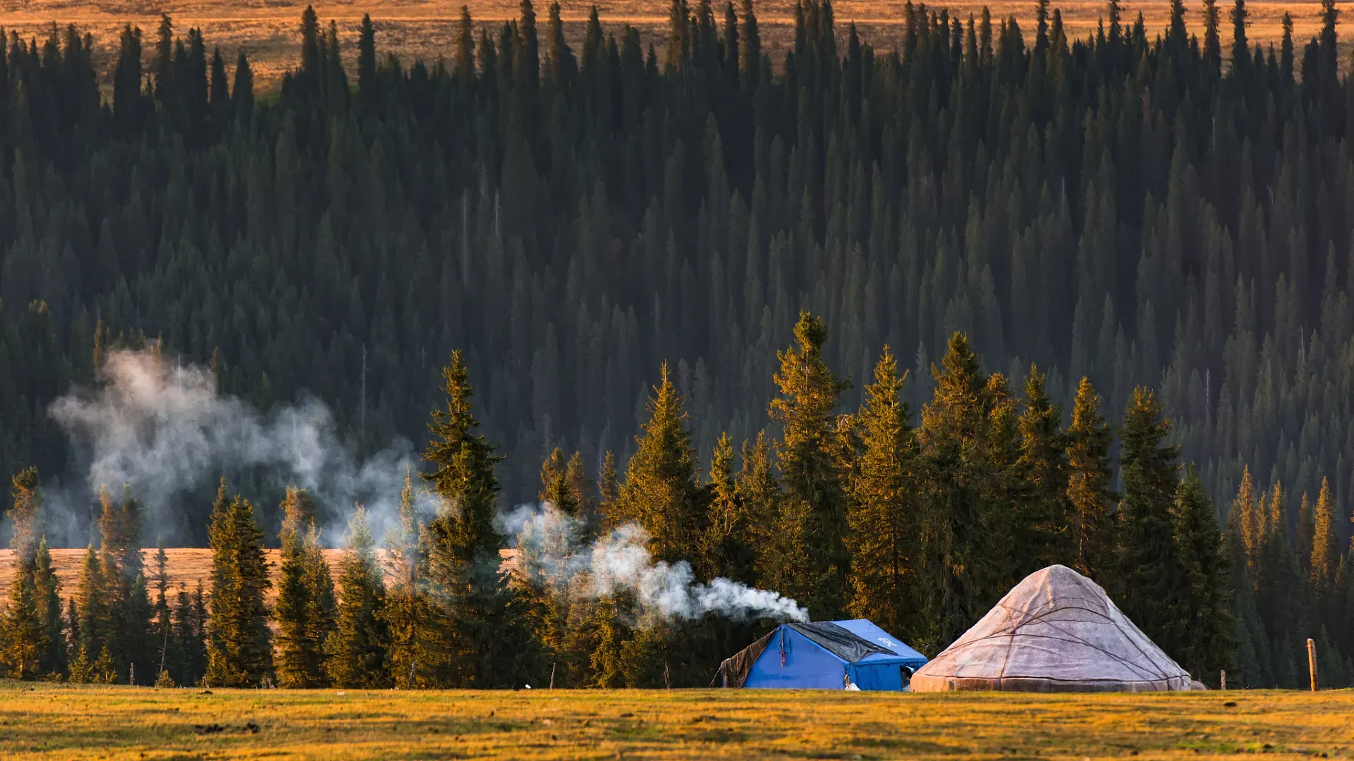 Kalajun Grassland Yurt Campfire Glow in Sunset, Xinjiang
