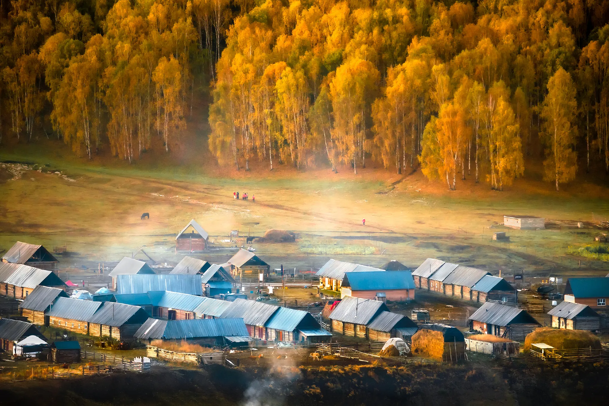 Kanas Life Haystacks Horses Mist in Autumn, Xinjiang