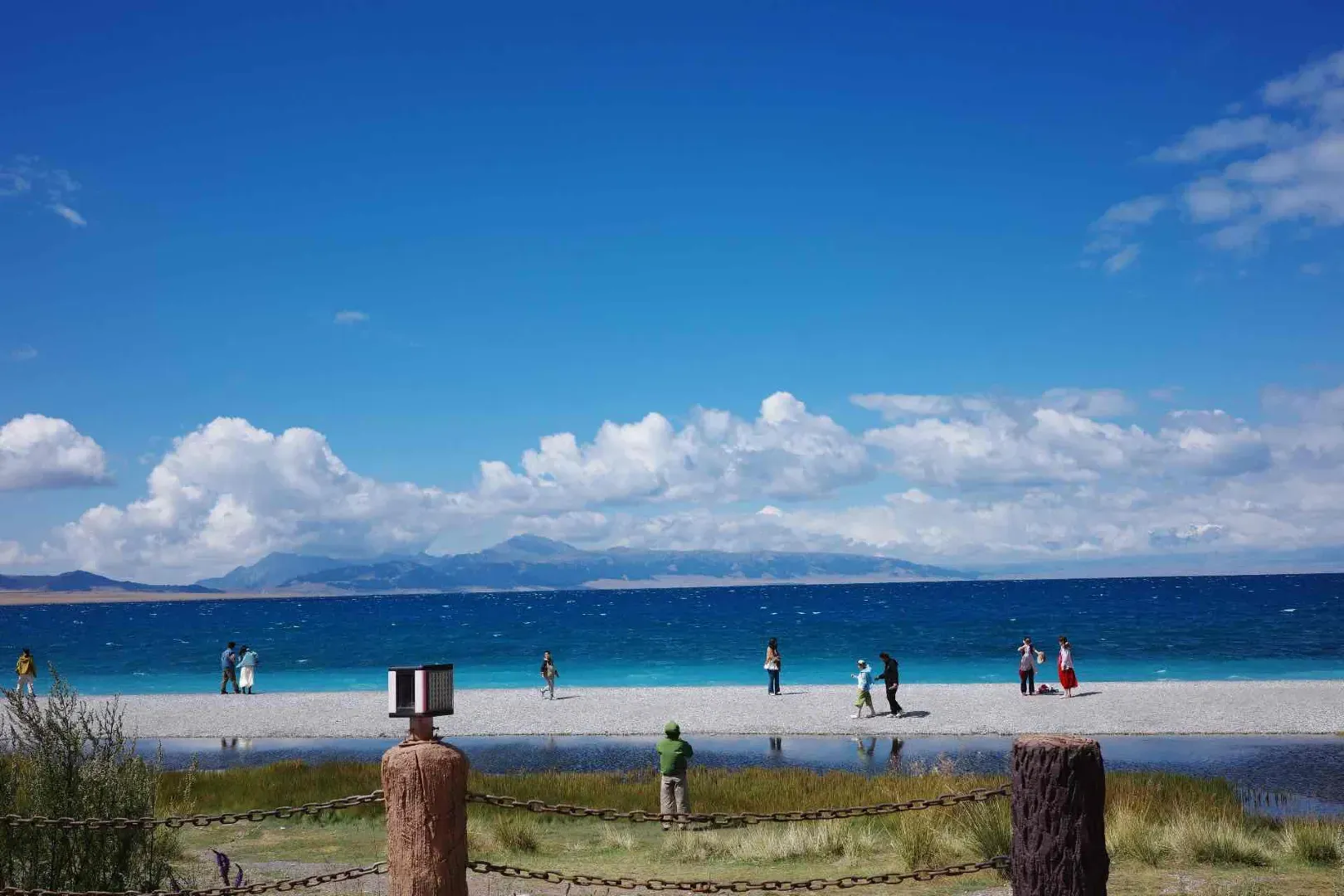 Sayram Lake summer beach and turquoise water under blue sky, Xinjiang