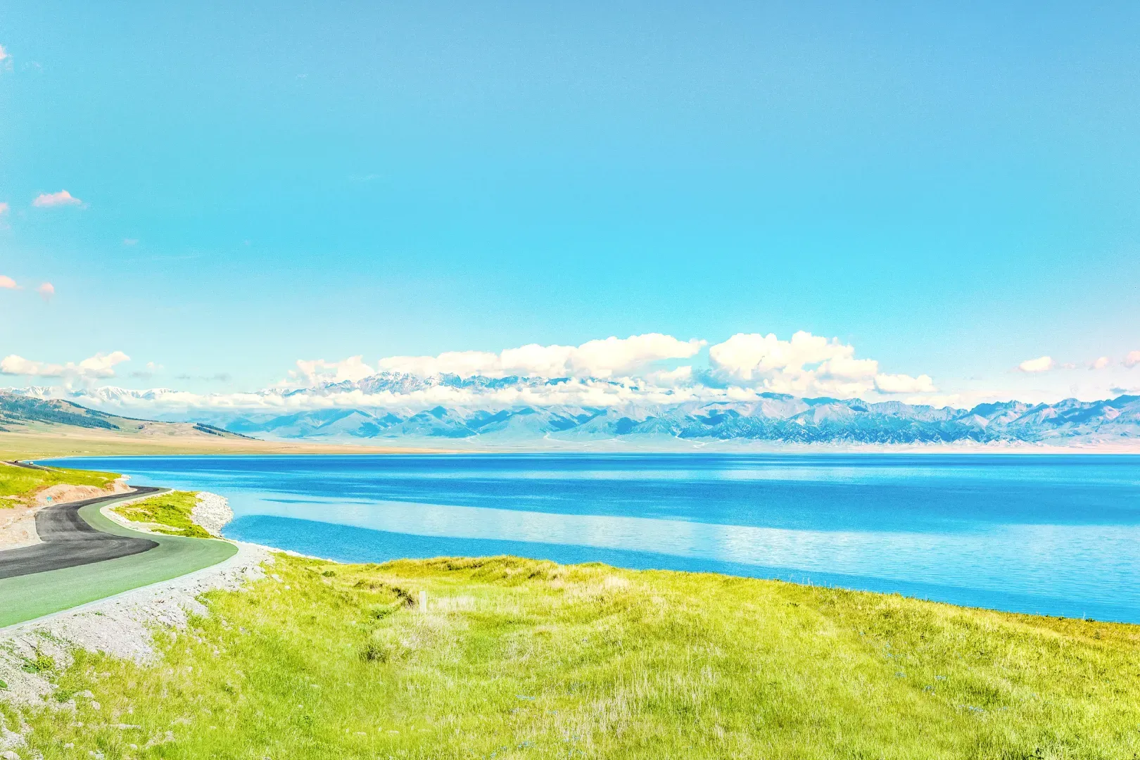 Sayram Lake Winding Road Green Meadow in Summer, Xinjiang
