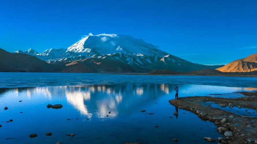 Karakul Lake Solitary Photographer in Sunrise, Xinjiang