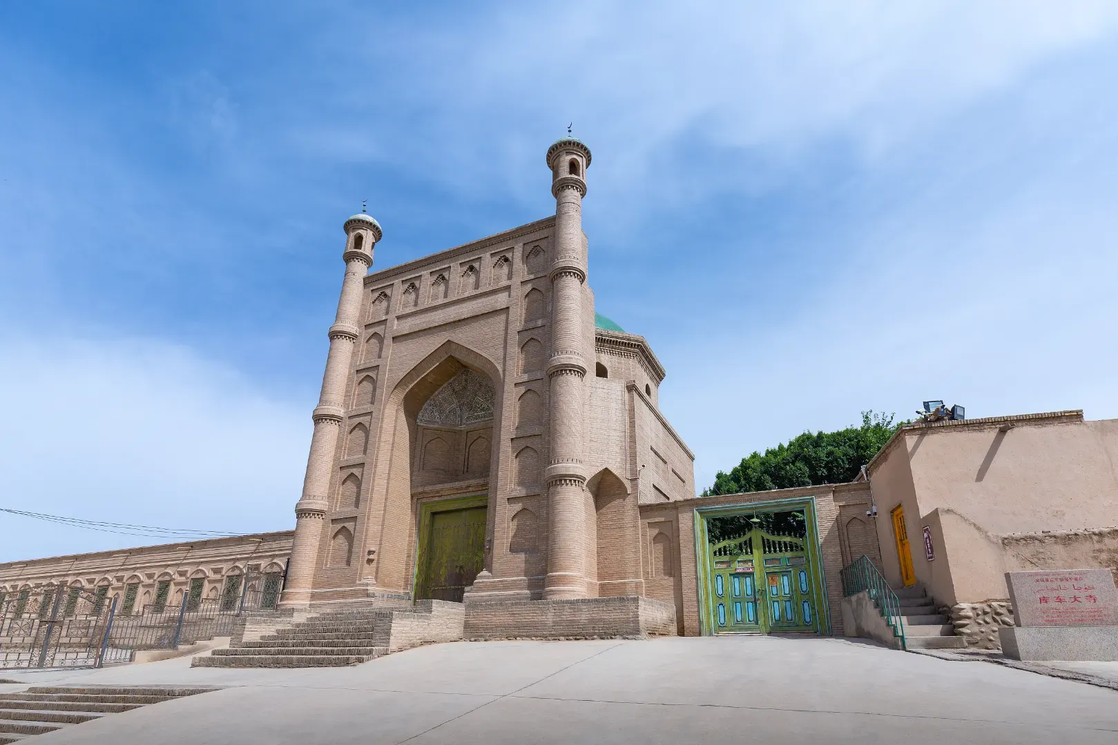 Kuqa Grand Mosque front gate exterior under blue sky